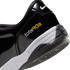 Close-up of the heel of a black patent leather Nike Total 90 III shoe with white and yellow branding, a white midsole, and a black textured outsole.