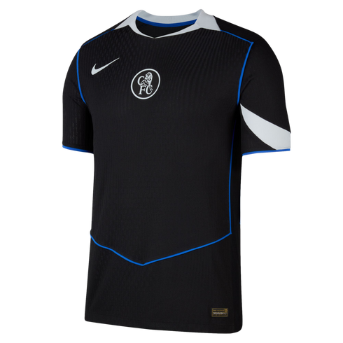 A black Nike Chelsea FC training shirt with a central crest, white details on the collar and sleeves, and thin blue piping.
