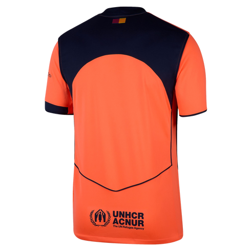 Back view of an orange and navy blue athletic jersey featuring a small striped flag at the collar and the UNHCR ACNUR logo on the lower back.