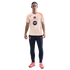 A full-length photo of a man wearing a peach FC Barcelona Nike training shirt, navy blue joggers, and coral soccer shoes against a black background.