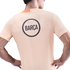 Back view of a person wearing a light orange t-shirt with a navy blue circular logo reading "BARÇA" on the back.
