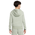 Back view of a child wearing a light green tracksuit with black-trimmed cuffs against a plain white background.