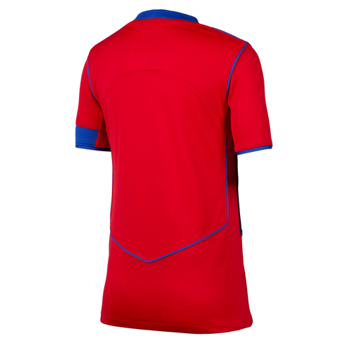 The back view of a short-sleeved red sports jersey with blue trim on the collar, sleeve ends, and a V-shaped seam detail on the lower back, shown against a black background.