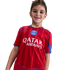 Smiling young boy wearing a red and blue Paris Saint-Germain soccer jersey with a Qatar Airways sponsor logo.
