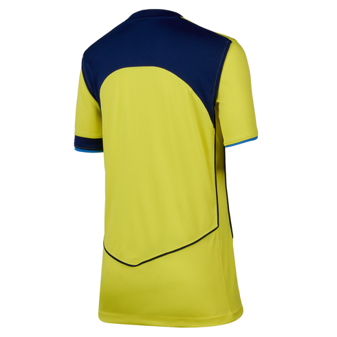 Rear view of a short-sleeved yellow athletic jersey featuring navy blue upper panels and V-shaped navy piping on the lower back.