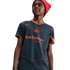 A young person wearing a red beanie and a grey Nike Inter Milan jersey with orange trim and "betsson .sport" branding, looking upward against a black background.