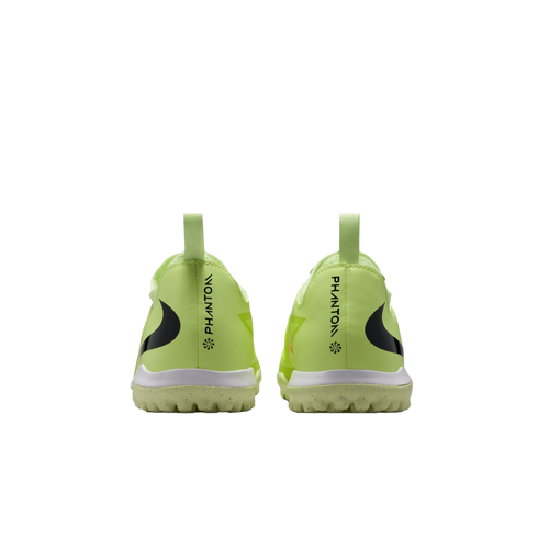 Rear view of two lime green Nike Phantom soccer turf shoes against a black background, showing "PHANTOM" branding on the heels.