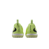 Rear view of two lime green Nike Phantom soccer turf shoes against a black background, showing "PHANTOM" branding on the heels.