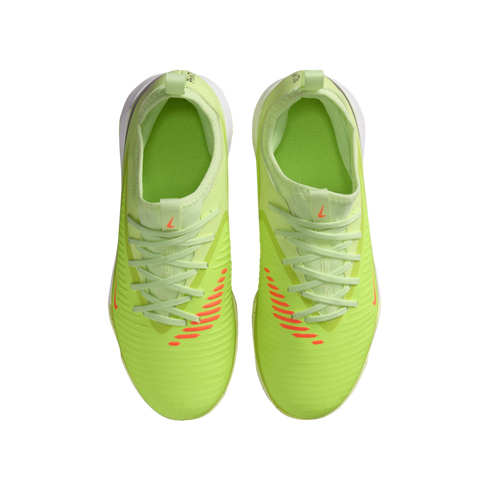 Top-down view of bright lime green Nike sneakers with orange accents and diagonal stripes on a black background.