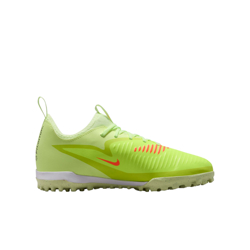 Side profile of a neon yellow Nike Phantom turf soccer shoe featuring an orange swoosh and a speckled grey studded outsole, set against a black background.