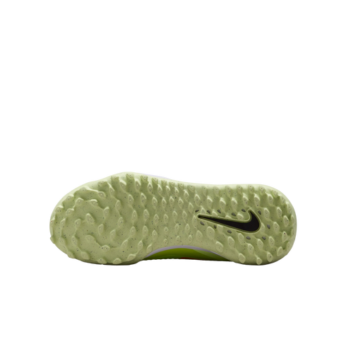 Underside of a pale green Nike shoe sole with small traction studs and a black swoosh logo, against a black background.