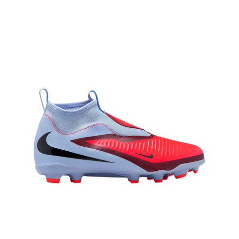 Profile of a light blue and bright red Nike laceless soccer cleat with a black swoosh, shown against a black background.