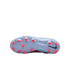 Bottom view of a light blue Nike soccer cleat with bright orange studs and a black Swoosh logo.