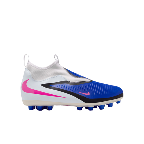 Side view of a white and blue laceless Nike soccer cleat with pink swoosh accents and black detailing, set against a black background.