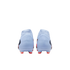 Rear view of a pair of light blue soccer cleats with orange studs, isolated on a black background.