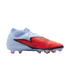 A light blue and vibrant red Nike Phantom soccer cleat with a textured forefoot and "PHANTOM" branding on the side.