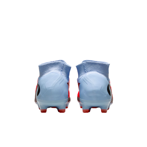 Rear view of light blue soccer cleats with high-top collars and red accents against a solid black background.