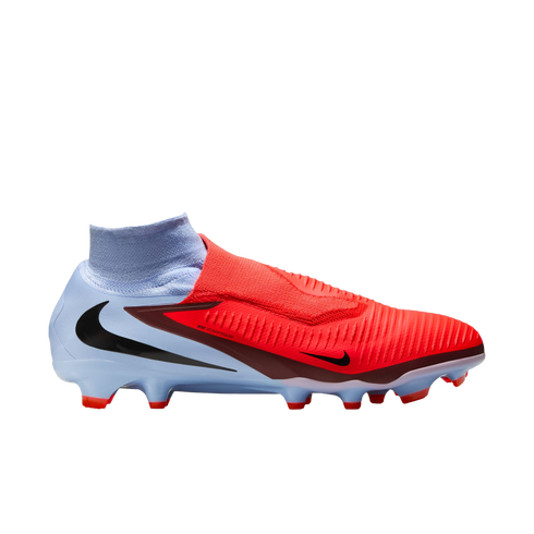 Nike Phantom Venom soccer cleat with a red textured upper, light blue heel, and a high-top sock collar.