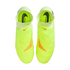 Top-down view of neon yellow Nike Phantom laceless soccer cleats on a black background, featuring orange accents and black Nike logos on the insoles.