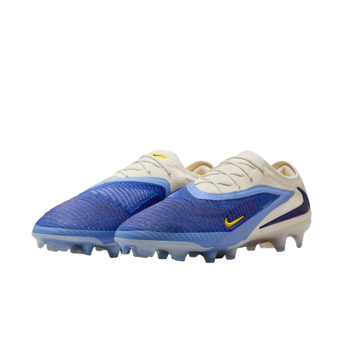 A pair of Nike soccer cleats featuring a textured blue forefoot, cream-colored heel and laces, and small yellow Nike swooshes.