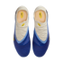 Top-down view of a pair of blue and white Nike soccer cleats with yellow accents and a textured blue forefoot.