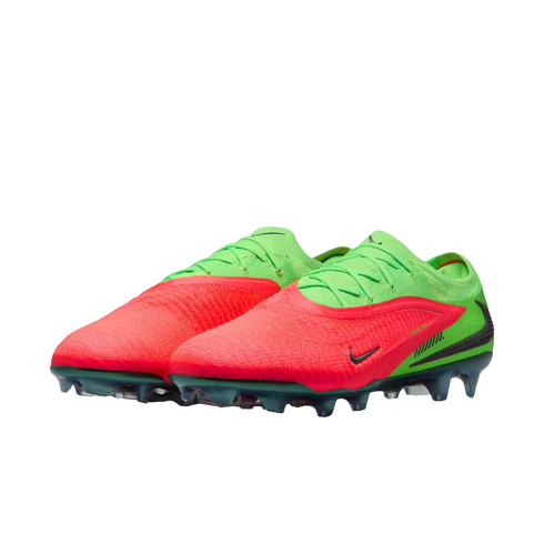 A pair of lime green and neon red Nike soccer cleats displayed against a black background. The cleats feature a vibrant red textured forefoot, green heel and lacing area, and clear green-tinted studs.