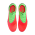 A top-down view of a pair of Nike soccer cleats featuring a vibrant neon orange and lime green color scheme. The shoes have a textured orange toe that transitions into a lime green heel with matching green laces. The interior is bright orange with green t