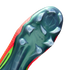 A close-up of the iridescent green soleplate of a Nike soccer cleat, featuring translucent studs and the text "NIKE CYCLONE 360" embossed in the center. The bright orange and green upper of the shoe is visible along the edges against a solid black backgro