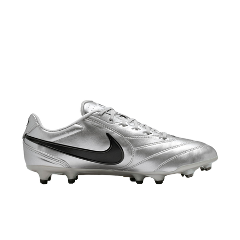 A metallic silver Nike soccer cleat with a black swoosh logo, shown in a side profile view against a black background.