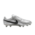 A metallic silver Nike soccer cleat with a black swoosh logo, shown in a side profile view against a black background.
