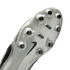 A close-up of the silver soleplate of a Nike soccer cleat, featuring black studs and a black Nike swoosh logo, set against a solid black background.