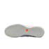 A bottom view of a Nike Futsal shoe showing a light grey rubber outsole with a geometric zig-zag traction pattern and an orange hexagonal logo in the center.