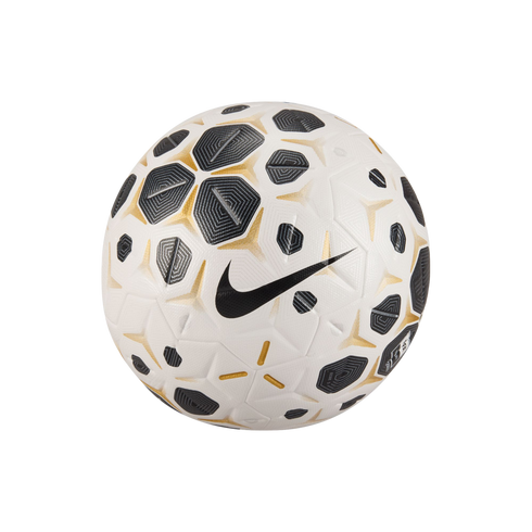 White Nike soccer ball with gold-trimmed black geometric patterns and a large black swoosh, isolated on a solid black background.