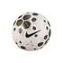 White Nike soccer ball with gold-trimmed black geometric patterns and a large black swoosh, isolated on a solid black background.
