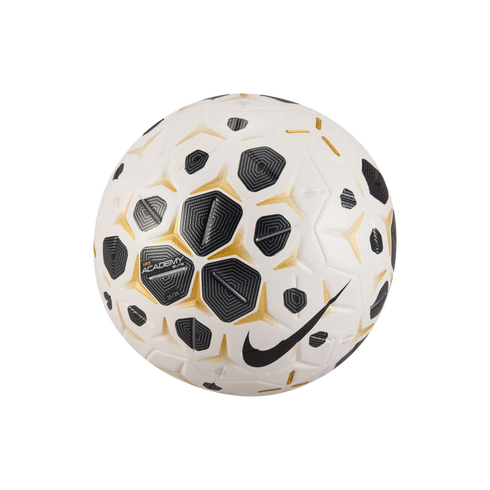 A Nike Academy Elite soccer ball with white, black, and gold geometric patterns and a large black swoosh, centered on a black background.