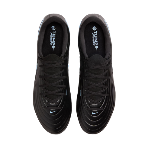 Top-down view of a pair of black Nike Tiempo Maestro soccer cleats with light blue accents, positioned against a solid black background.