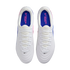 Top-down view of white Nike Tiempo Maestro soccer cleats with blue insoles, pink accents, and white laces against a black background.