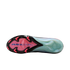 Sole of a Nike soccer cleat with a pink forefoot, blue "AIR ZOOM" text, and black/pink studs. The heel section is translucent light green.