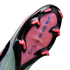 Bottom view of a soccer cleat soleplate featuring a black frame, pink translucent base with "AIR ZOOM" text, and bright pink studs against a black background.