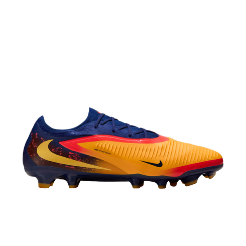 Side view of a colorful Nike soccer cleat in orange, red, and blue with a textured upper and yellow swoosh logo.