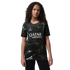 A young person with curly hair wearing a black marbled Paris Saint-Germain soccer jersey, standing against a black background.