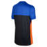 Back view of a short-sleeved athletic shirt featuring royal blue on top, black on the bottom, and a bright orange side panel.