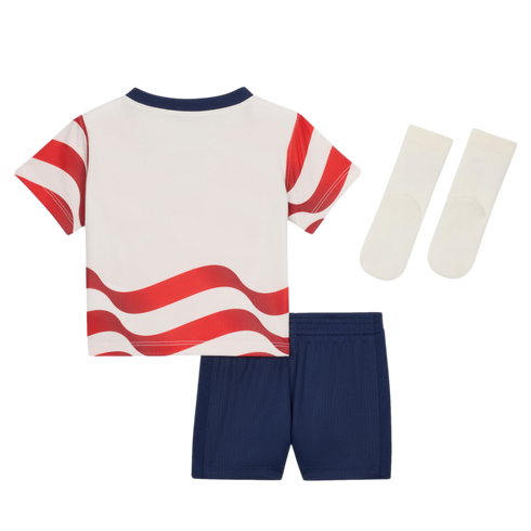 A child's athletic set: white t-shirt with red wavy stripes, dark blue shorts, and white socks.