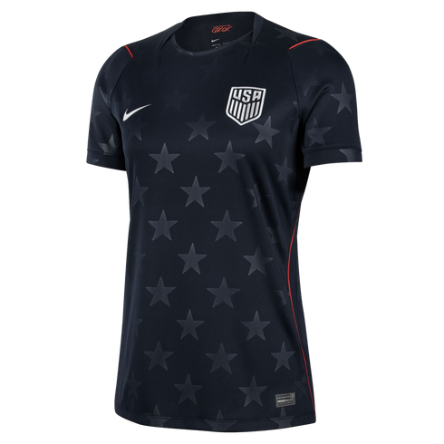 Navy blue Nike USA soccer jersey with a subtle star pattern, white team crest, and thin red accents on the shoulders and sides.