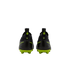 A rear view of a pair of black Nike soccer cleats with bright lime green soles and accents against a solid black background.