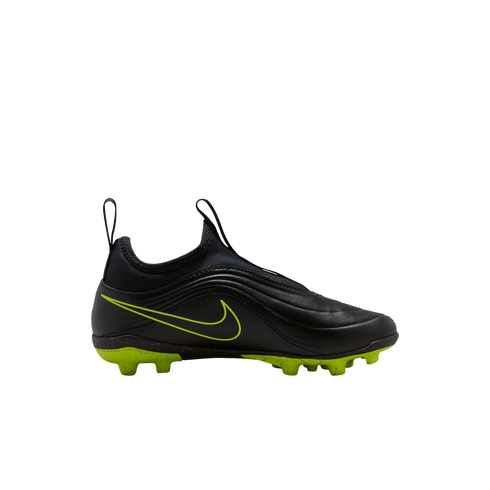 A side-view profile of a black Nike laceless soccer cleat with a lime green swoosh and lime green studded sole, set against a black background.