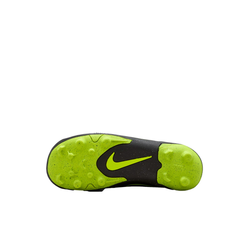 The underside of a Nike soccer cleat with a neon green and black studded sole, set against a black background. A neon green swoosh is centered on the black midfoot section.