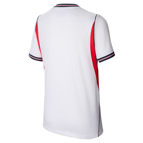 Back view of a white sports jersey with red side panels and navy-and-red striped trim on the collar and cuffs, against a black background.