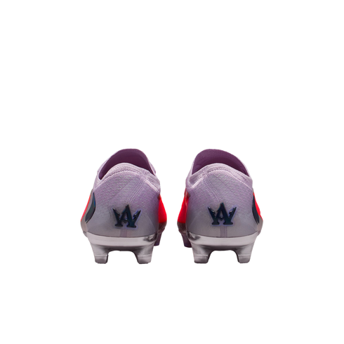 Rear view of lavender soccer cleats with metallic silver soles and a blue stylized logo on each heel, shown against a black background.