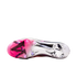 Underside of a Nike soccer cleat showing a metallic silver and pink soleplate with circular studs against a black background.